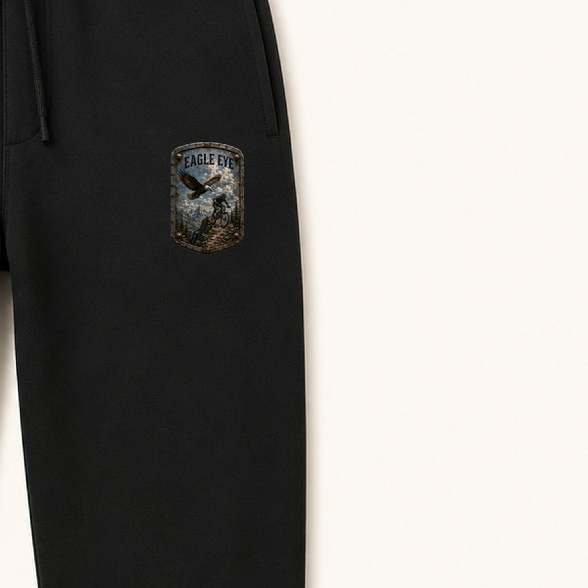 Eagle Eye Trail Relics Sweatpants — left-thigh placement close-up