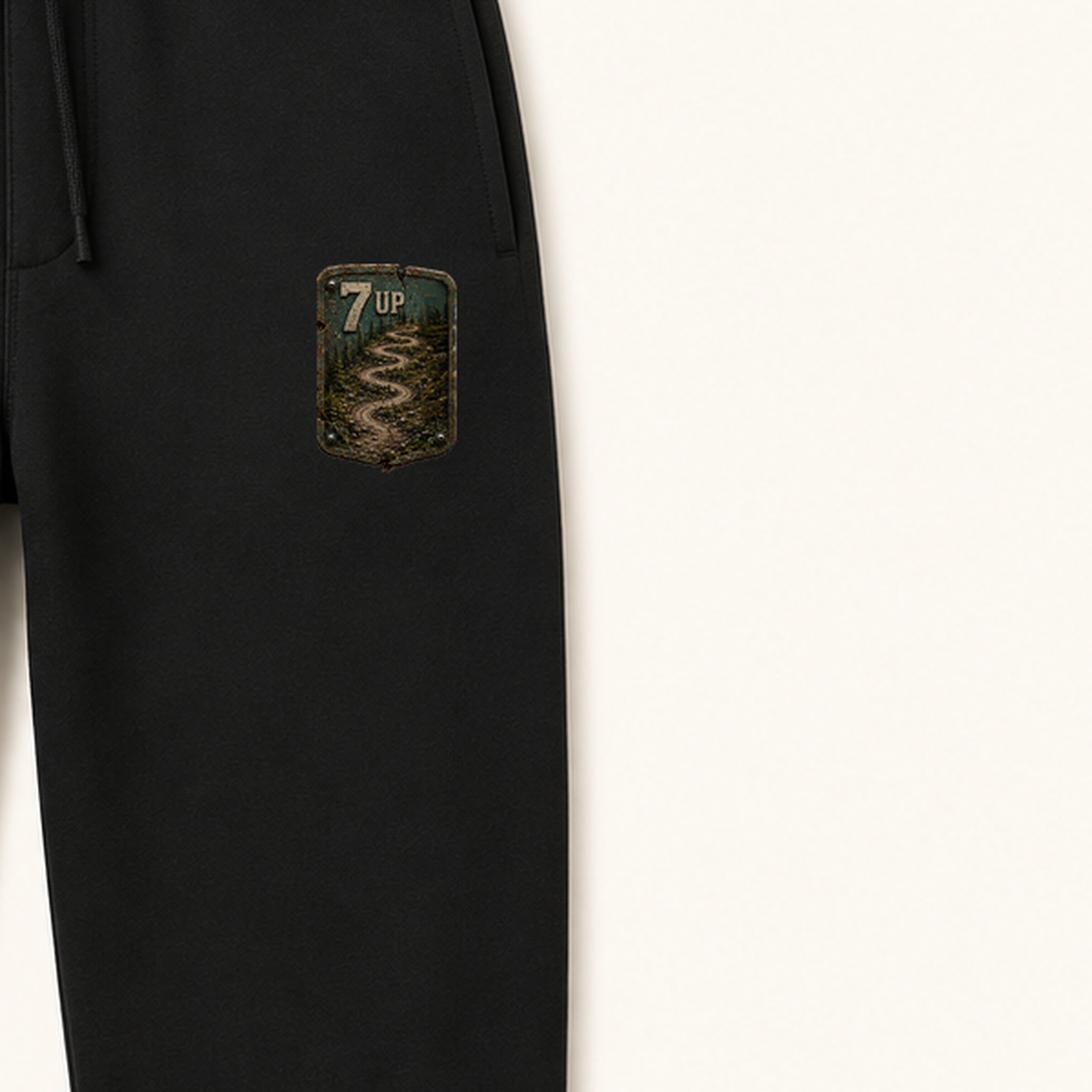 7 Up Trail Relics Sweatpants — left-thigh placement close-up